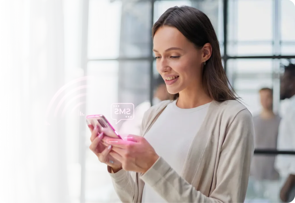 Young woman smiling at a pink-cased smartphone with a translucent signal-wave UI overlay card, representing seamless mobile connectivity and messaging services powered by TrueSignal