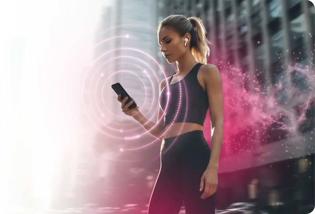 Young woman in activewear holding a smartphone with wireless earbuds, surrounded by glowing concentric signal-wave rings and a vivid magenta particle cloud, representing 5G mobile connectivity and digital empowerment in TrueSignal's telecommunications network